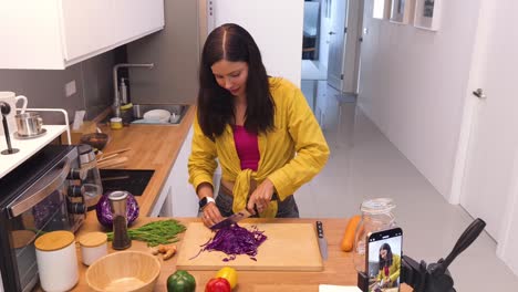 woman chopping red cabbage for a healthy recipe tutorial