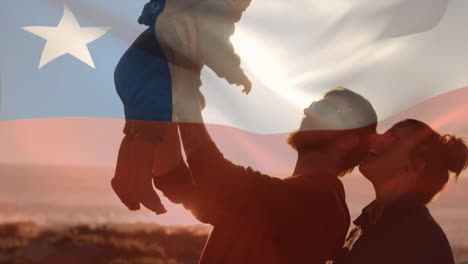 animation of flag of chile over caucasian parents and baby on beach