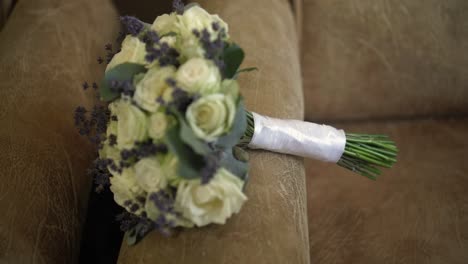 the groom picks up a bouquet