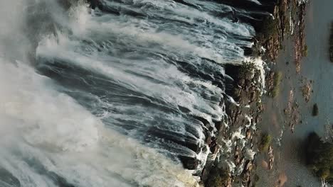 vertical aerial view victoria falls, shungu namutitima at the border of zimbabwe and zambia in africa