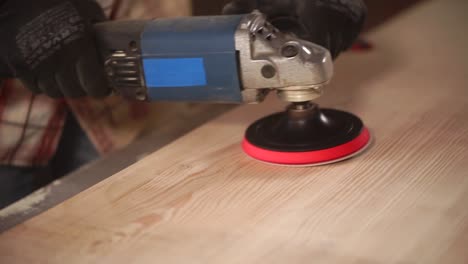 sanding a wood slab with a circular sander