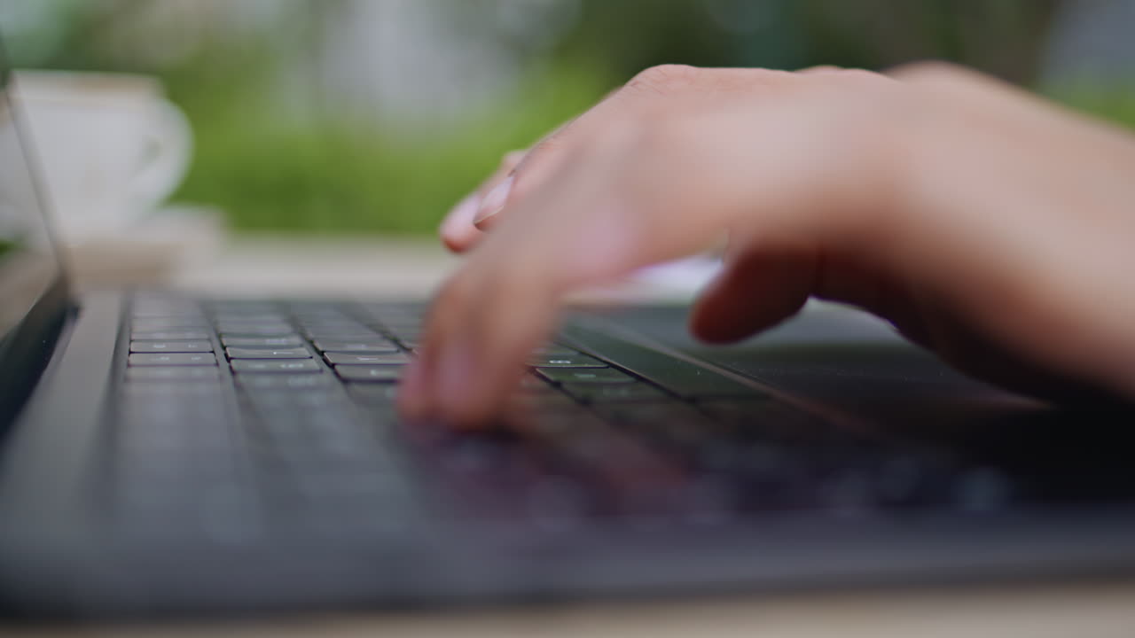 Closeup freelancer hands typing laptop at modern desk. Female hands working
