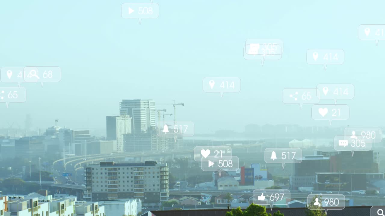 여러 소셜 미디어 아이콘의 애니메이션이 도시 풍경의 공중 전망에 대해 떠다니고 있습니다.