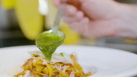 Cook-Preparing-Pasta-Dish-In-Italian-Restaurant-5