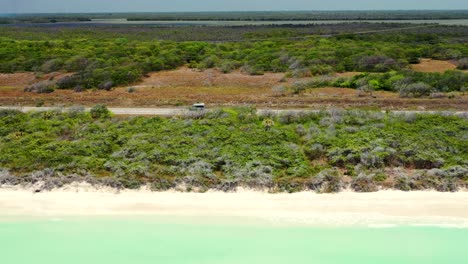 footage-of-a-car-driving-on-a-highway-by-turquoise-water-of-the-Gulf-of-Mexico-during-sunny-day