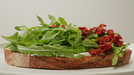 delicious bruschetta with arugula and sun-dried tomatoes