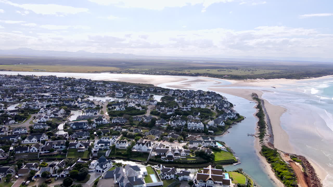 Aerial view of beach and breakwater protecting exclusive St Francis Bay canals