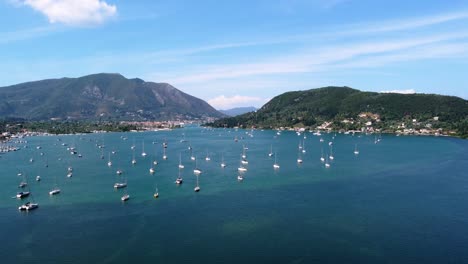 aerial over vlicho bay full of anchored sailing boats, lefkada, greece