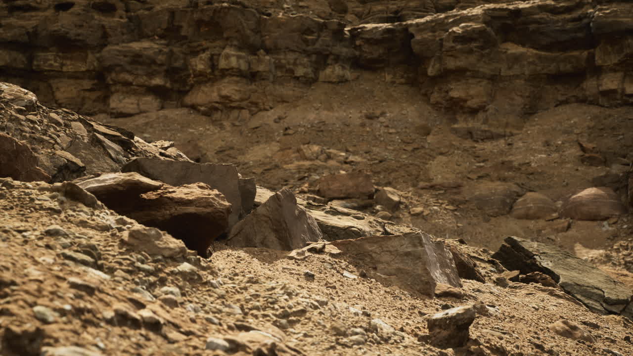Rocky desert landscape with dry terrain and rugged rock formations