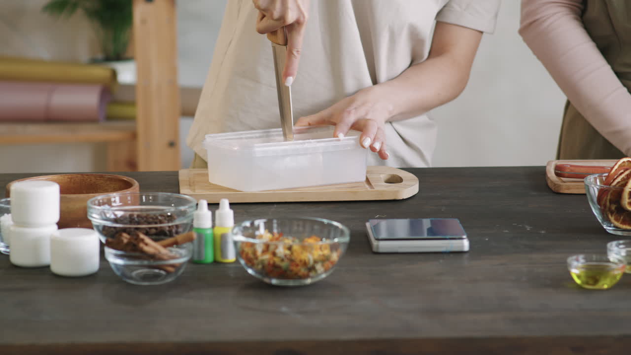 Woman Cutting Premade Soap Base