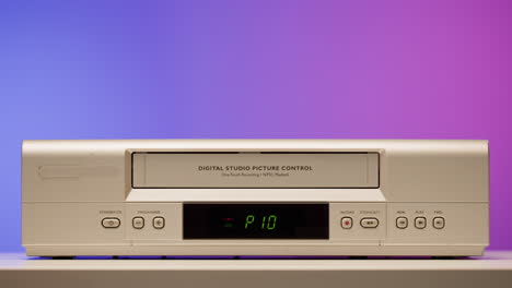 vintage vhs vcr with hand
