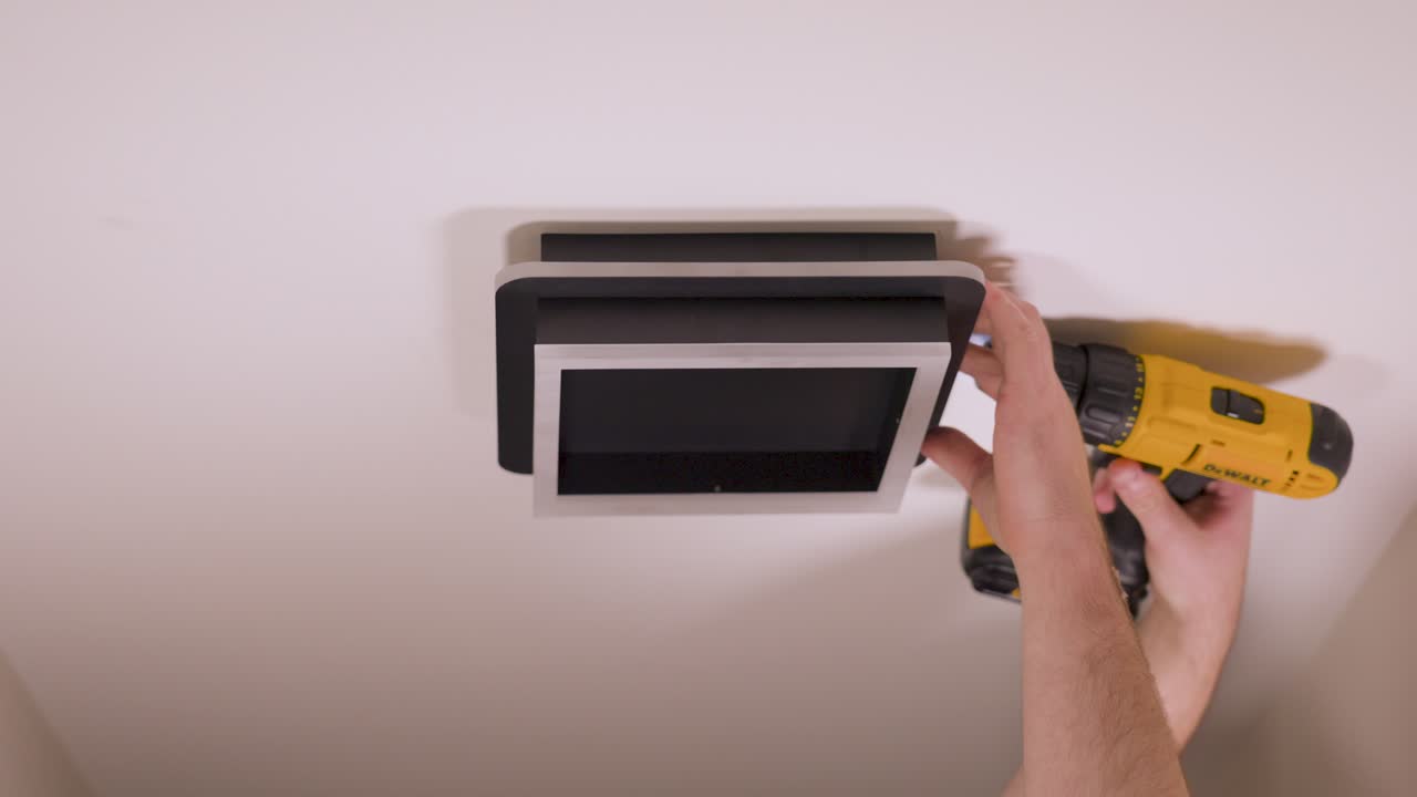 Drilling in the final screw to hold in everything in place