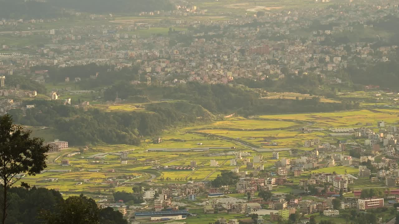 Aerial View of Kathmandu City Cityscape in Nepal at Sunset with Big Beautiful Dramatic Sunset Clouds and Sky and Beautiful Golden Light, Elevated View from Above