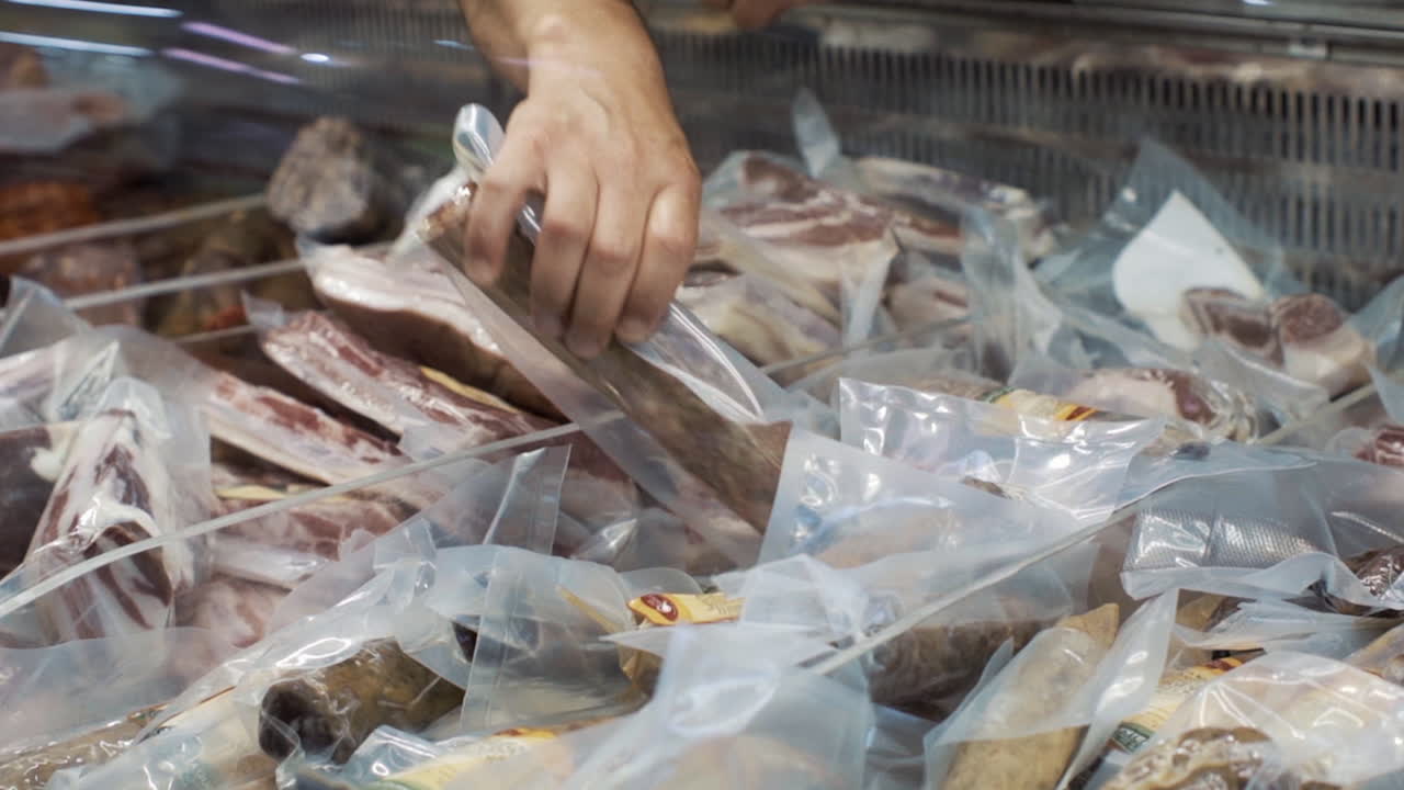 Charcutier Arranges Ham, Chorizo, and Cheese – Traditional Portuguese Store