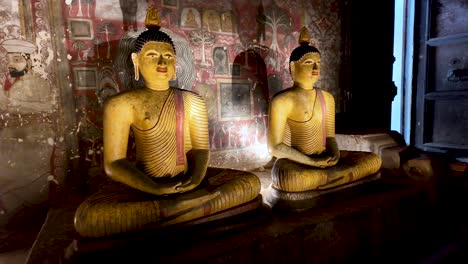 ancient buddha statues in a sri lankan temple