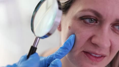 Skin examination with magnifying glass