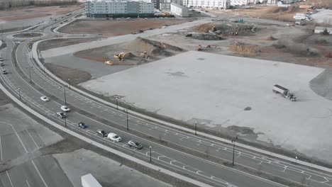 trailer truck transporting sand at a construction site in weymouth, massachusetts - aerial drone