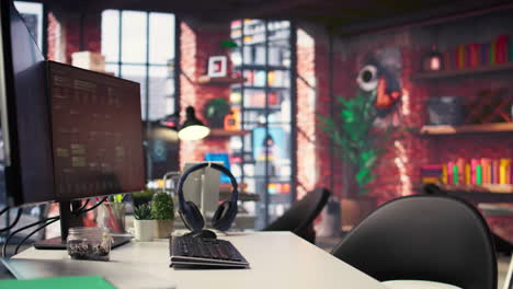 office desktop setup includes monitors displaying terminal interfaces