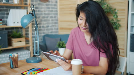 woman working from home with digital tablet