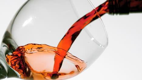 red wine pouring into glass low angle view