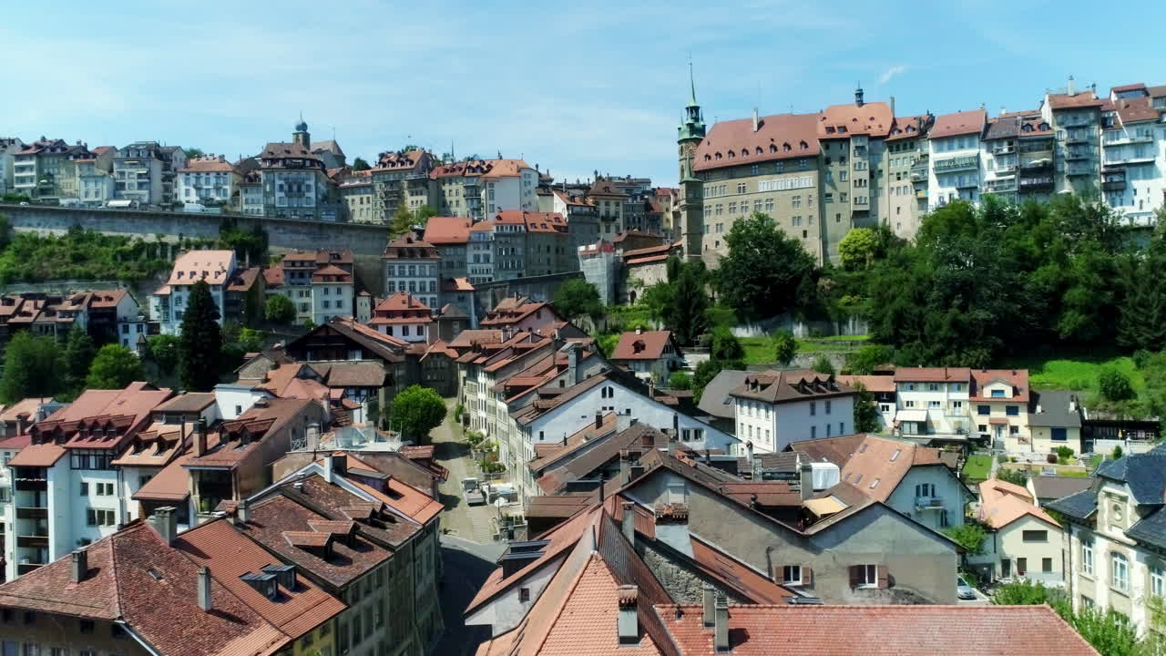 Drone aerial rising over fribourg switzerland village - city summer