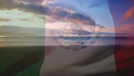 Animation-of-flag-of-mexico-waving-over-person-on-beach,-cloudy-blue-sky-and-sea