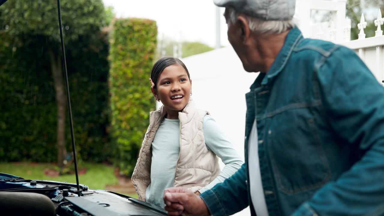 Grandfather and Granddaughter Bonding Over Car Repair