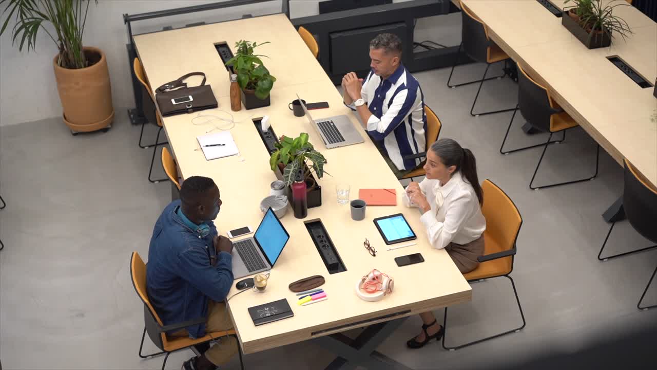 Group of multiracial colleagues working on laptops