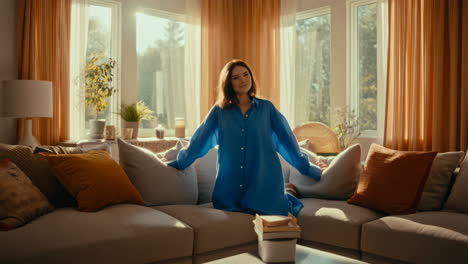 a woman relaxing on a couch in a sunlit living room