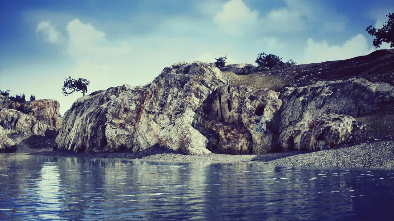 Serene waterfront landscape with rocky cliffs and calm water during daylight