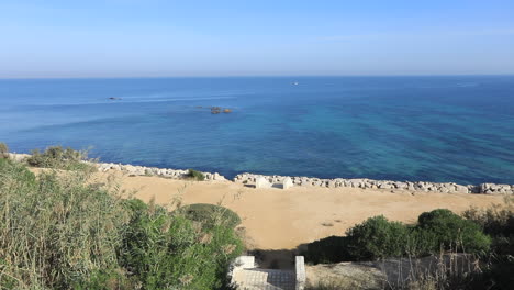 scenic tunisian coastline with clear blue water and sandy beach on a sunny day