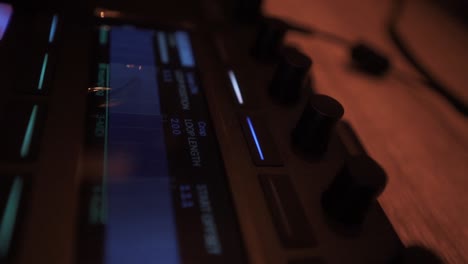 close up shot of a music production console in a sound studio, slow motion