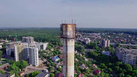 a city with residential buildings and a large pipe