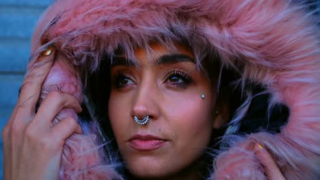 Woman-with-nose-ring-and-fur-jacket-standing-outside-the-shop-4k