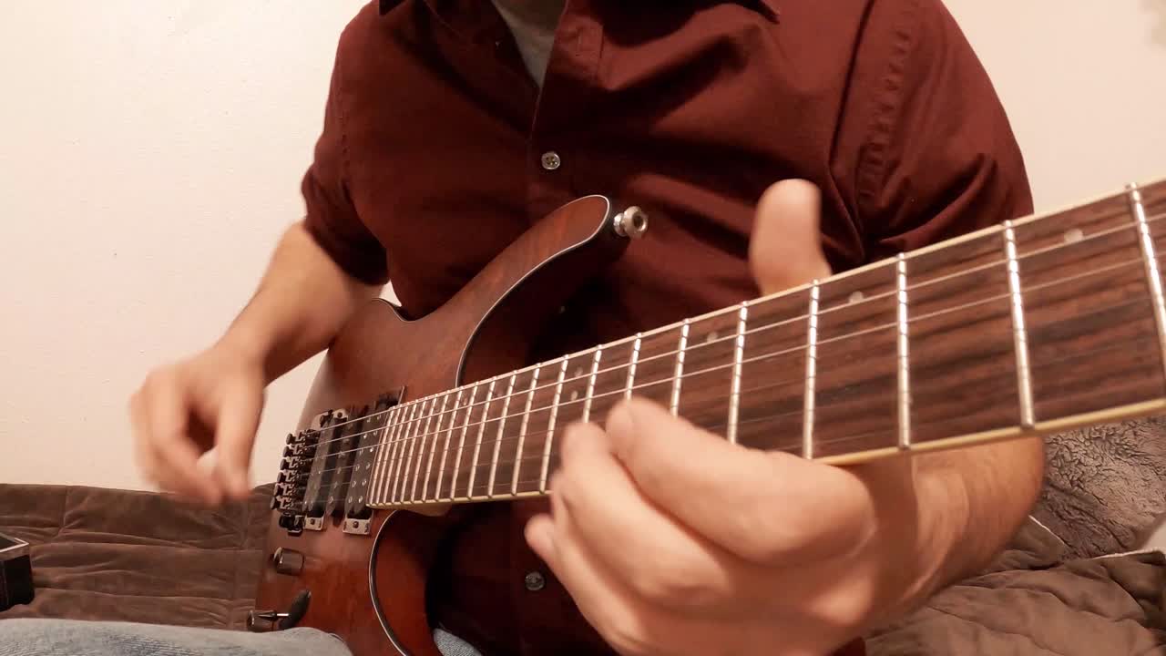 Playing scales and music on a guitar with many notes and positions.