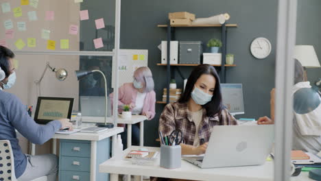 office workers wearing masks during covid-19 pandemic