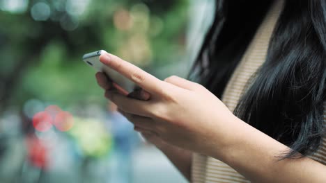 Handheld-view-of-woman-using-mobile-phone