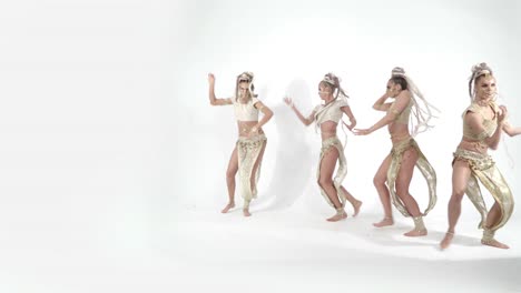 female dancers in golden tribal costumes