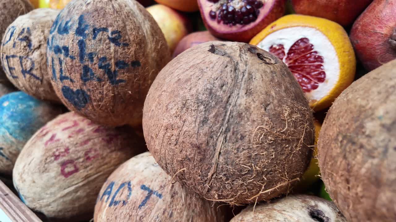 Coconuts and Other Fruits at a Market