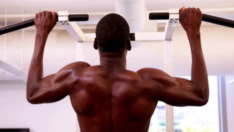 Fit-shirtless-man-doing-pull-ups