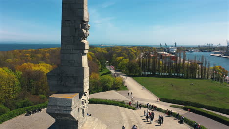 aerial shot of drone flying around historical monument in westerplatte, gdansk, poland