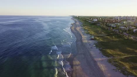 a beautiful video of a aqua green marine beach at sunset