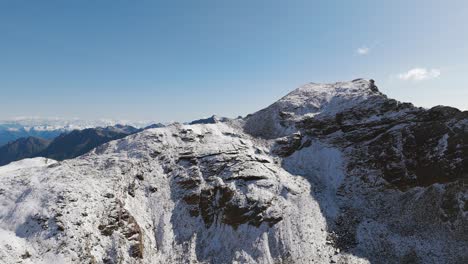 aerial view of valmalenco snowy mountains and cima fontana summit in northern italy