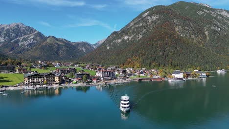 Cruise Boat Sails across Lake Achensee in Pertisau, Tyrol, Austria - Aerial 4k