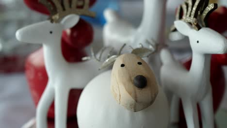 pan around reindeer and sheep christmas decorations sitting on table