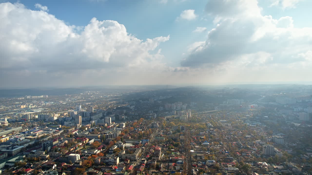 Aerial drone view of Chisinau, Moldova. View of the city centre with multiple buildings and streets with yellowed trees