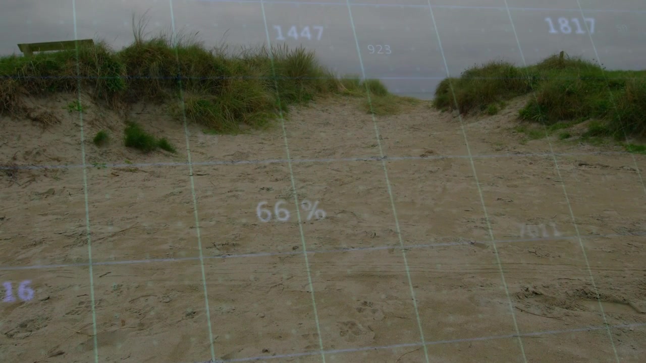 Holographic overlay appearing over sand path, numbers and grid rising for coastal survey