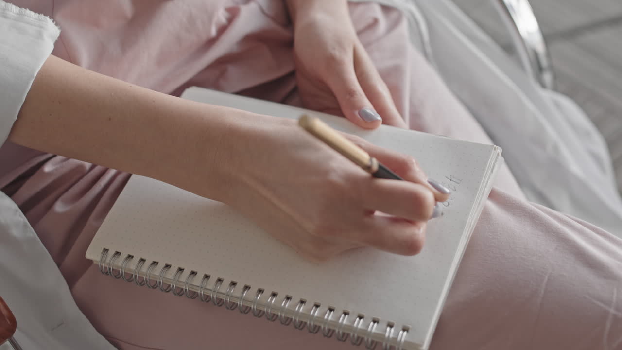 Woman writing in a notebook