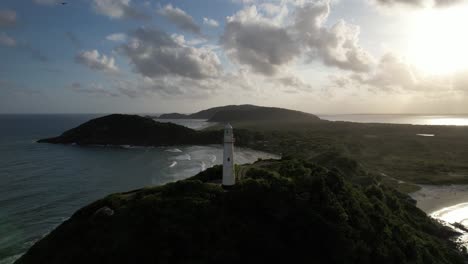 aerial view of the sunset on conchas lighthouse and beaches of ilha do mel, paran?