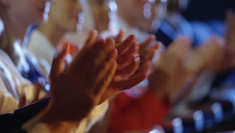 Business-people-applauding-while-sitting-on-seats-in-auditorium-4k